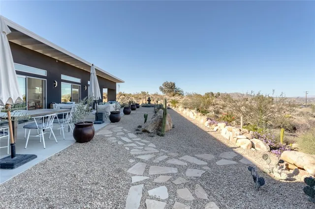 a terrace of a house with table and chairs