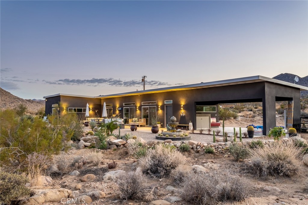 7802 Quail Springs Road Joshua Tree, CA 92252 - Photo 3 of 46 a group of people sitting in front of retail shop