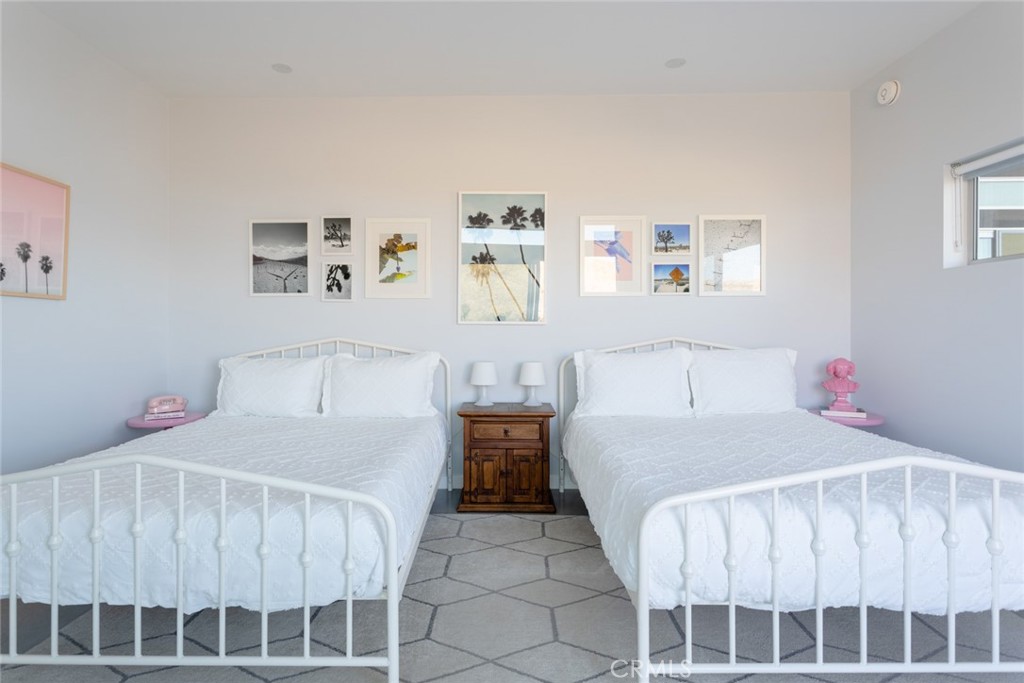 7802 Quail Springs Road Joshua Tree, CA 92252 - Photo 32 of 46 a bedroom with a bed and window