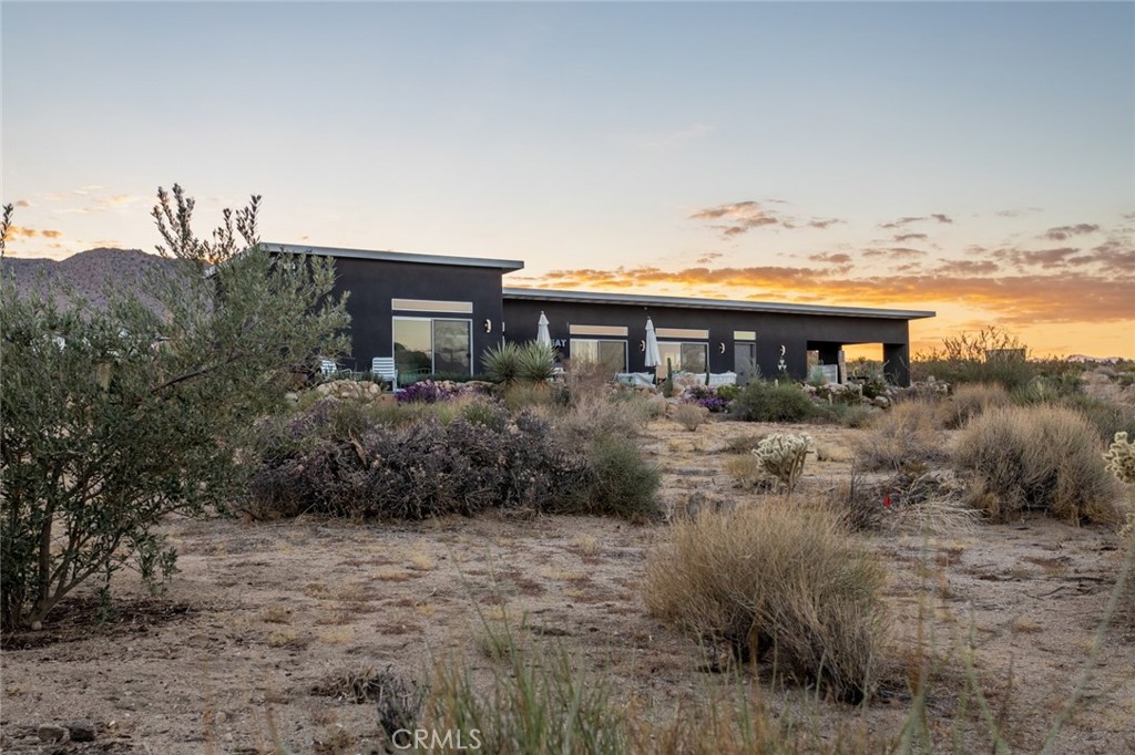 7802 Quail Springs Road Joshua Tree, CA 92252 - Photo 42 of 46 a view of a house with a yard