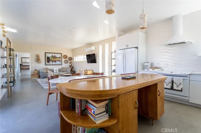 a kitchen with a sink cabinets and window