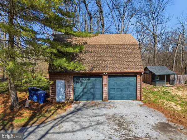 a open kitchen with stainless steel appliances granite countertop a refrigerator and a sink
