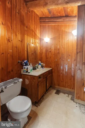 a bedroom with a bed next to a window