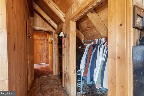 a view of hallway with wooden floor