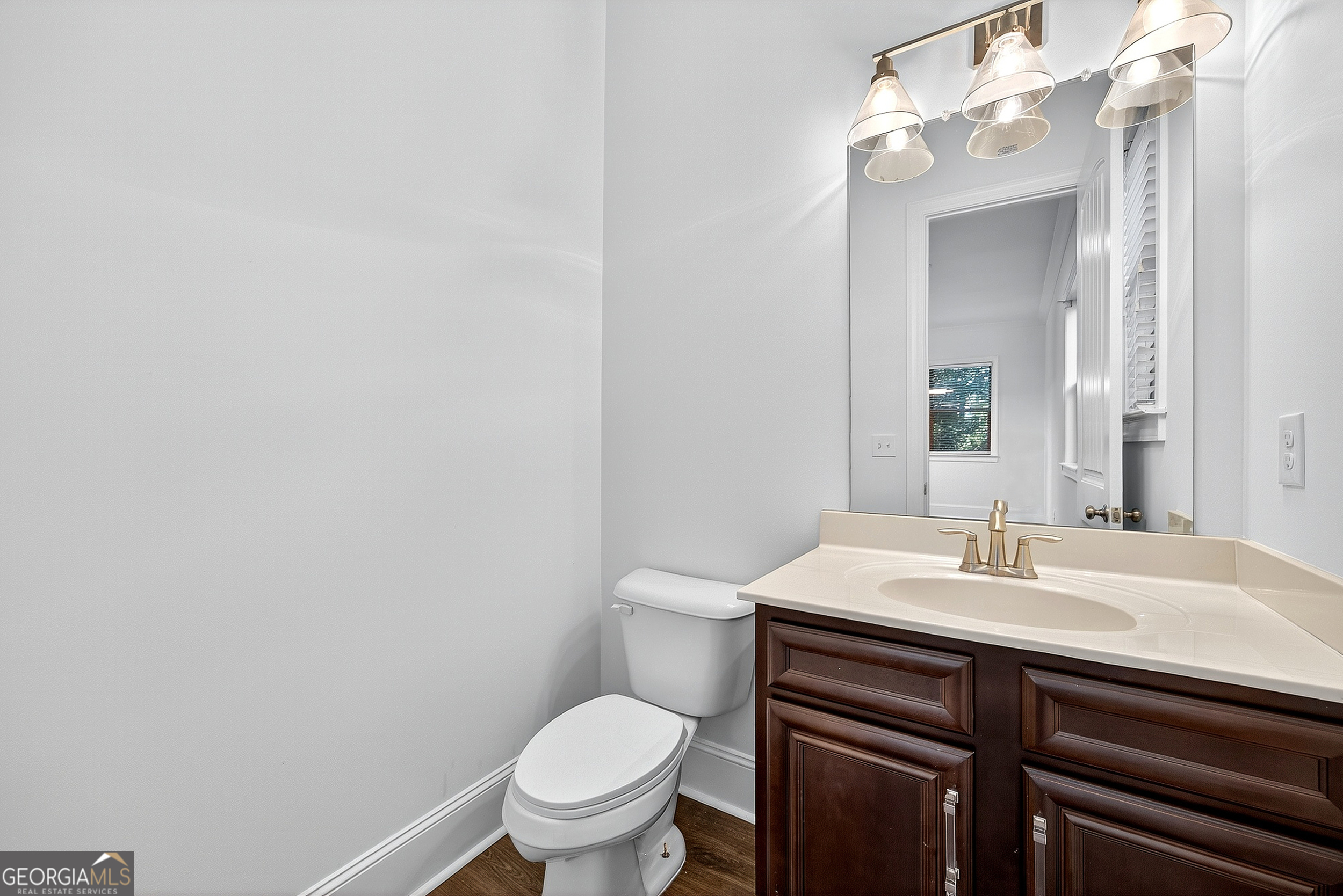 712 Avondale Hills Drive Decatur, GA 30032 - Photo 16 of 29 a bathroom with a sink a toilet and a mirror