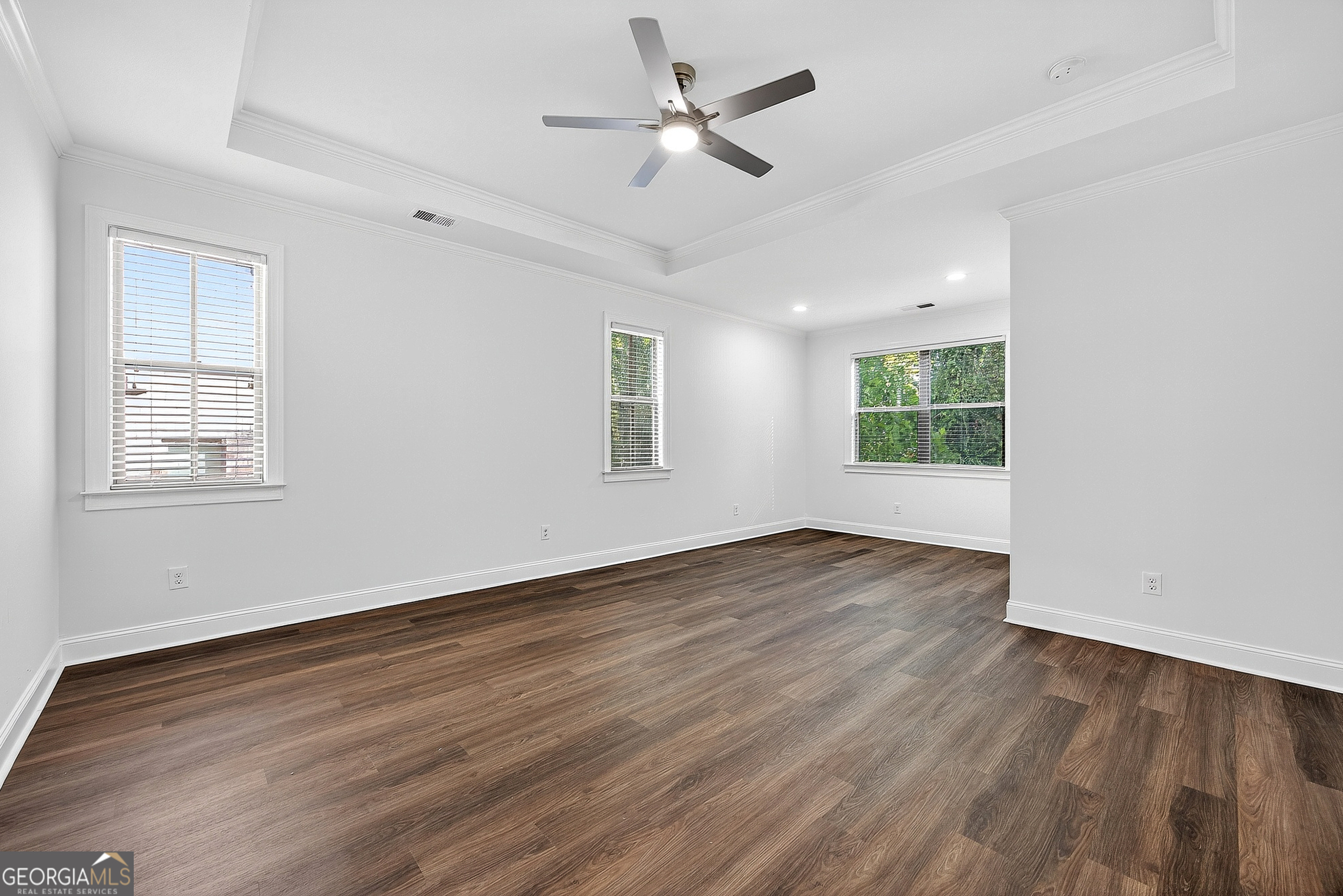 712 Avondale Hills Drive Decatur, GA 30032 - Photo 21 of 29 a view of an empty room with wooden floor and a window
