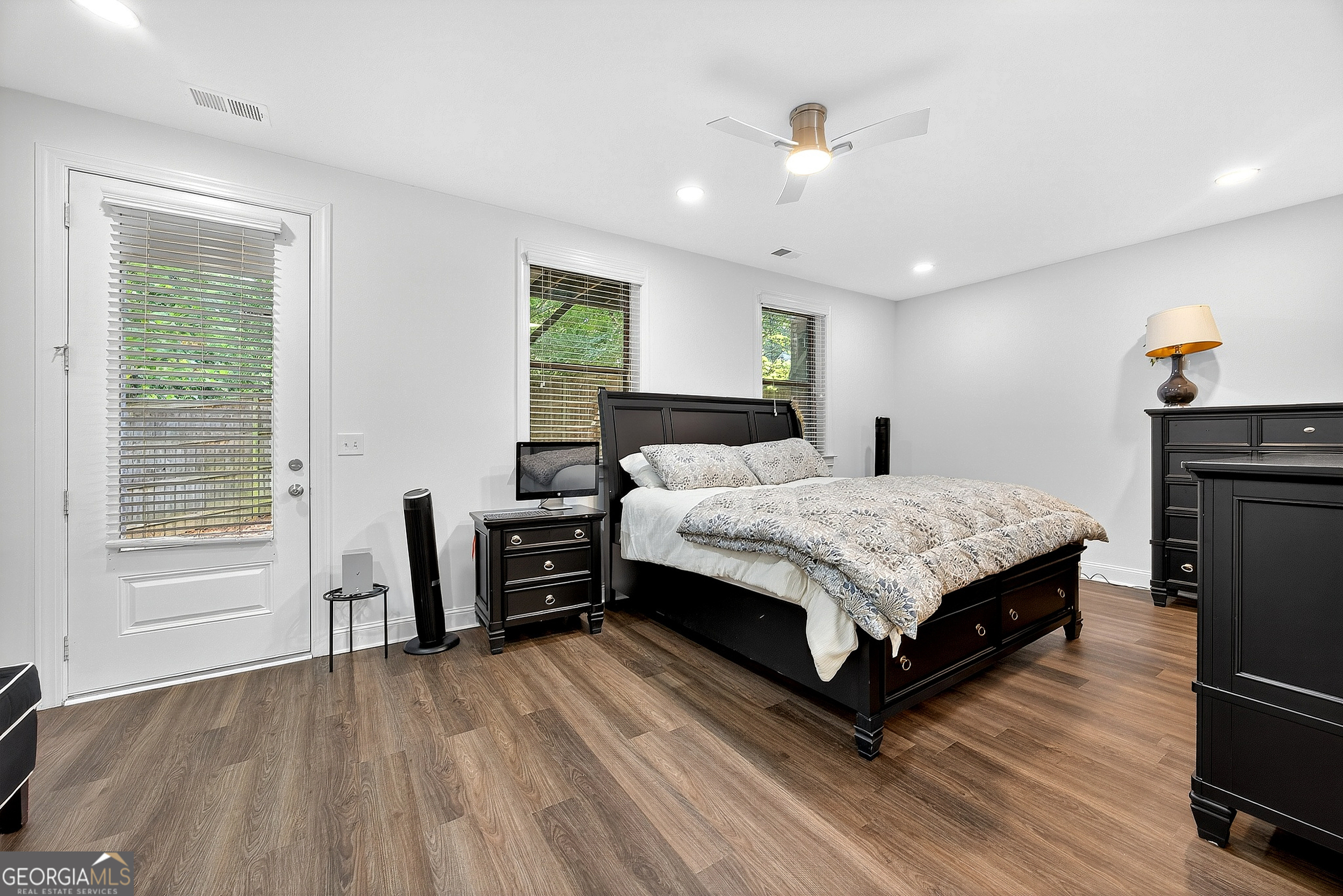 712 Avondale Hills Drive Decatur, GA 30032 - Photo 26 of 29 a bedroom with a bed and wooden floor