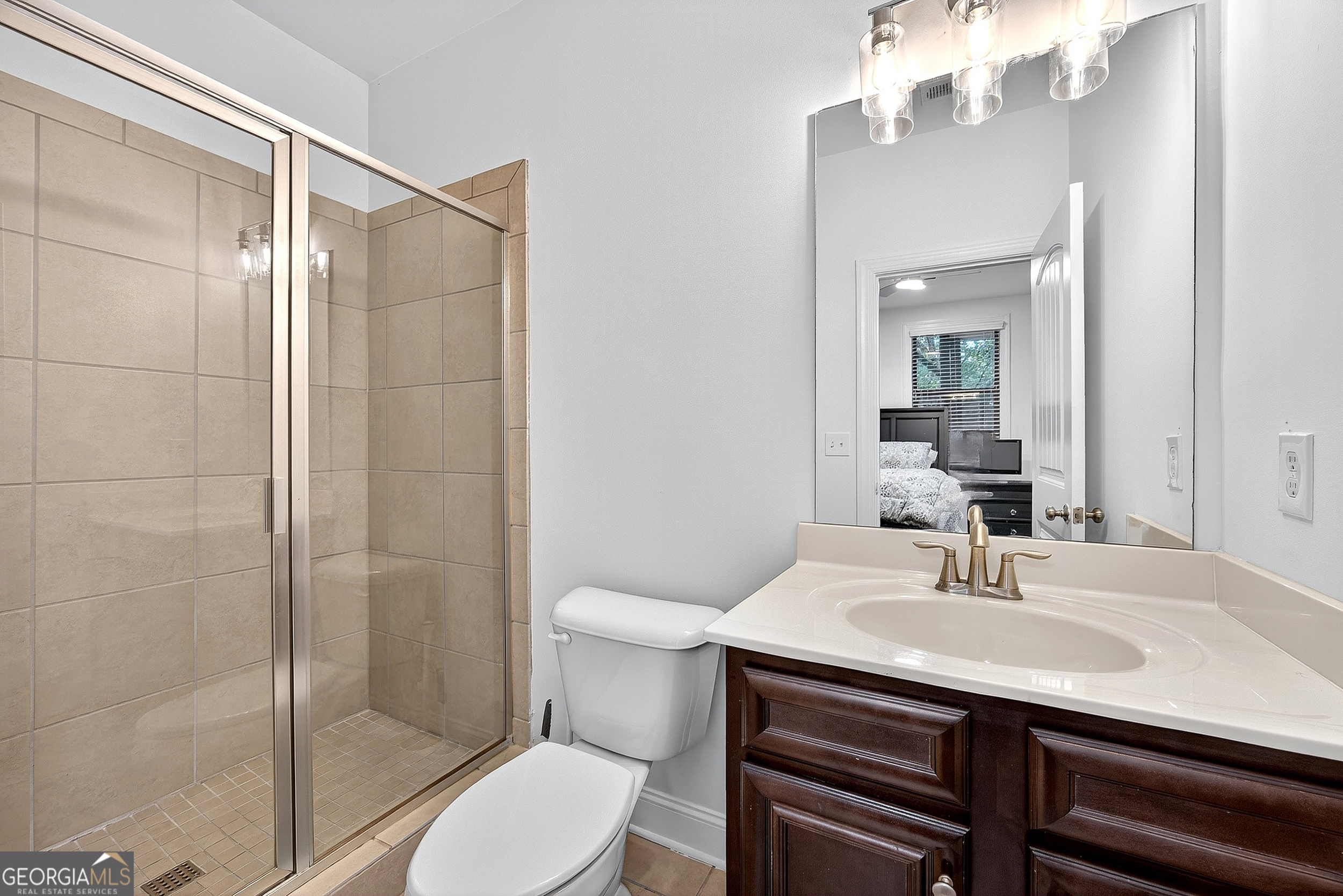 712 Avondale Hills Drive Decatur, GA 30032 - Photo 28 of 29 a bathroom with a sink toilet and shower