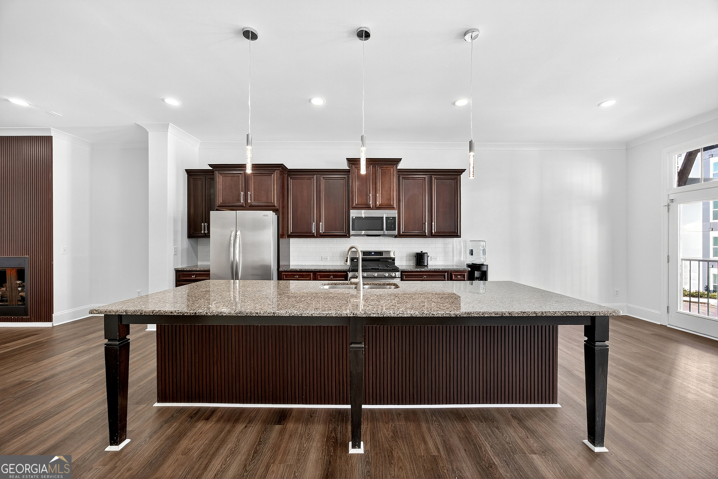 712 Avondale Hills Drive Decatur, GA 30032 - Photo 8 of 29 a large kitchen with stainless steel appliances kitchen island granite countertop a sink and cabinets