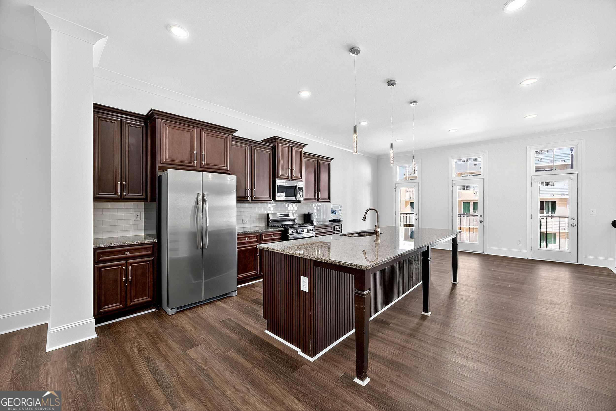 712 Avondale Hills Drive Decatur, GA 30032 - Photo 9 of 29 a kitchen with stainless steel appliances a sink dishwasher a refrigerator and wooden floor
