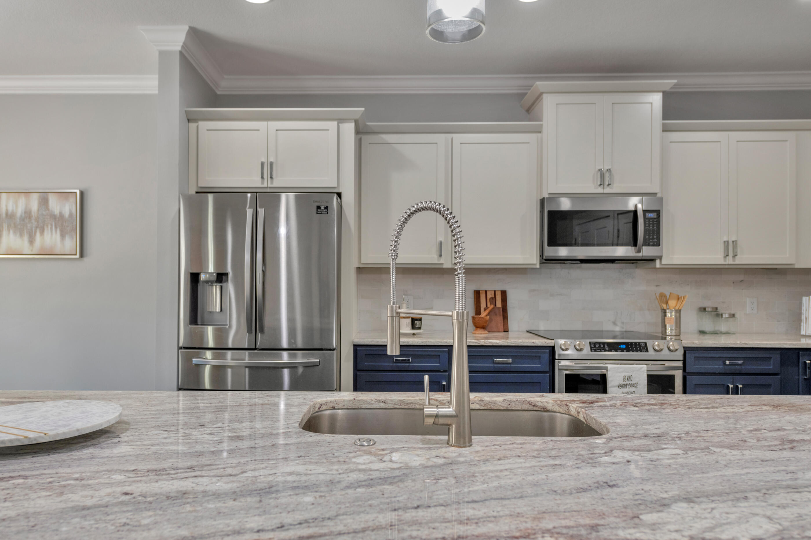 1504 West Ponderosa Road Fort Walton Beach, FL 32547 - Photo 13 of 51 a kitchen with stainless steel appliances granite countertop a refrigerator and microwave
