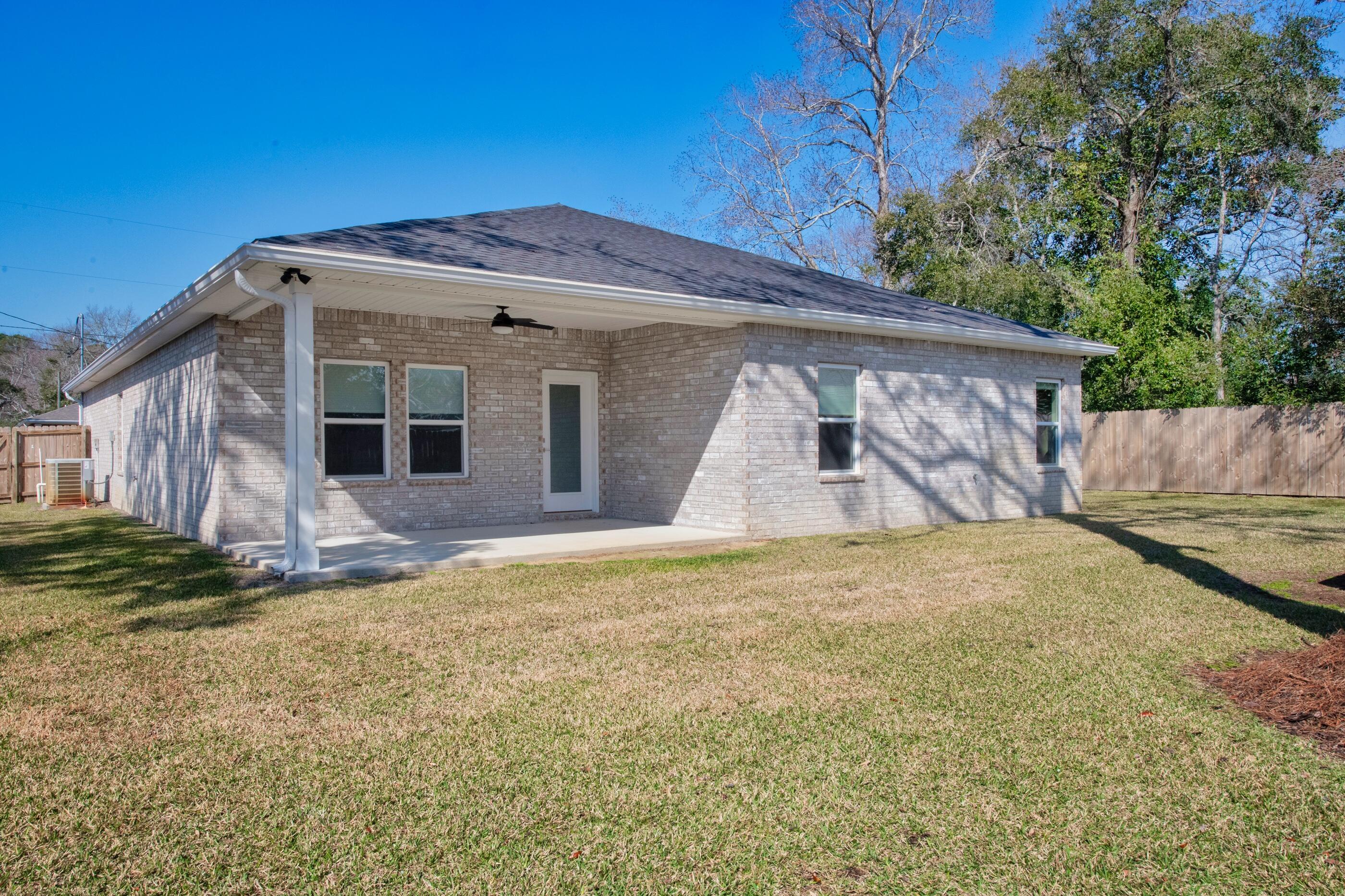 1504 West Ponderosa Road Fort Walton Beach, FL 32547 - Photo 2 of 51 a front view of a house with a yard