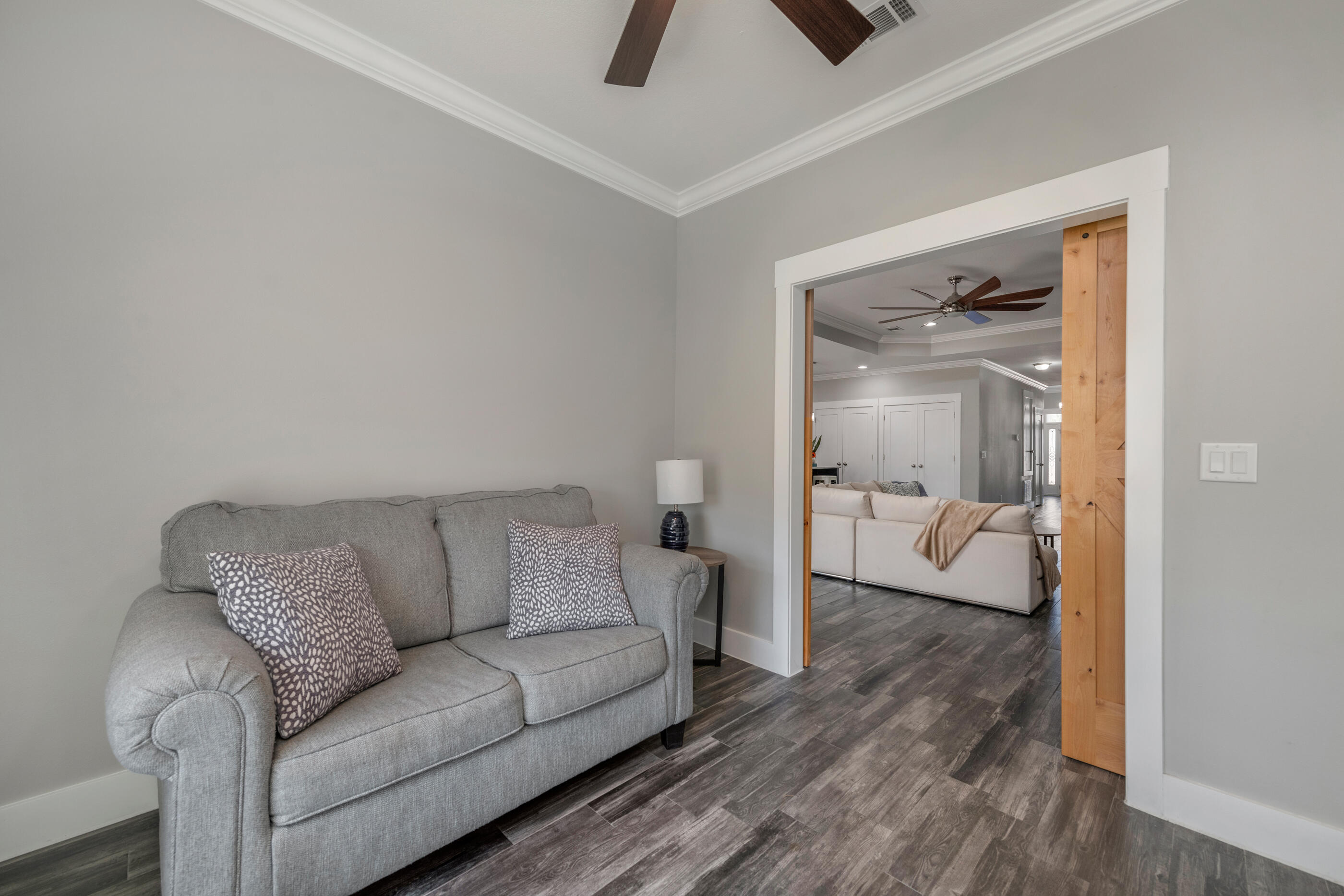 1504 West Ponderosa Road Fort Walton Beach, FL 32547 - Photo 25 of 51 a living room with furniture and a wooden floor