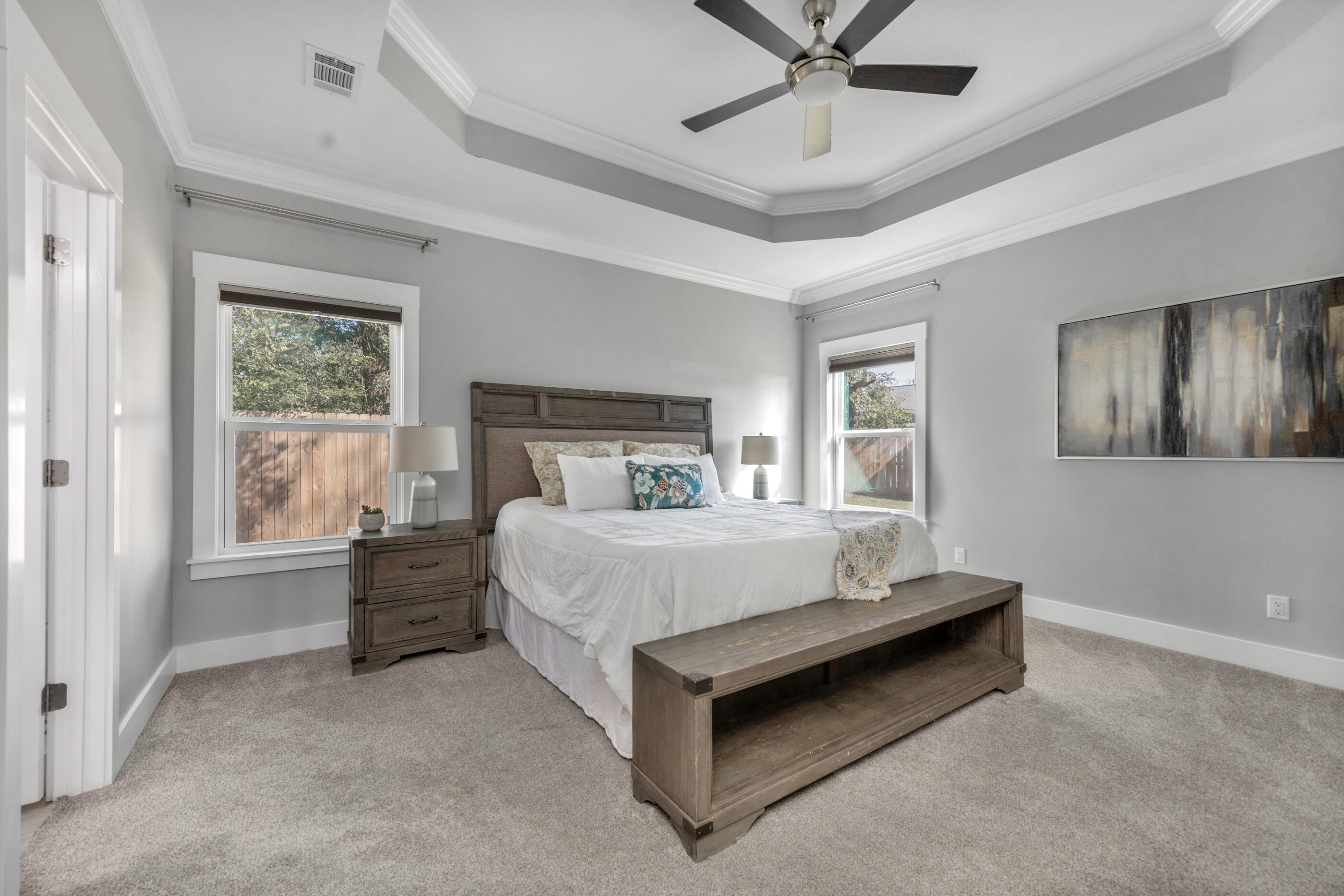 1504 West Ponderosa Road Fort Walton Beach, FL 32547 - Photo 28 of 51 a bed sitting in a spacious bedroom next to a window