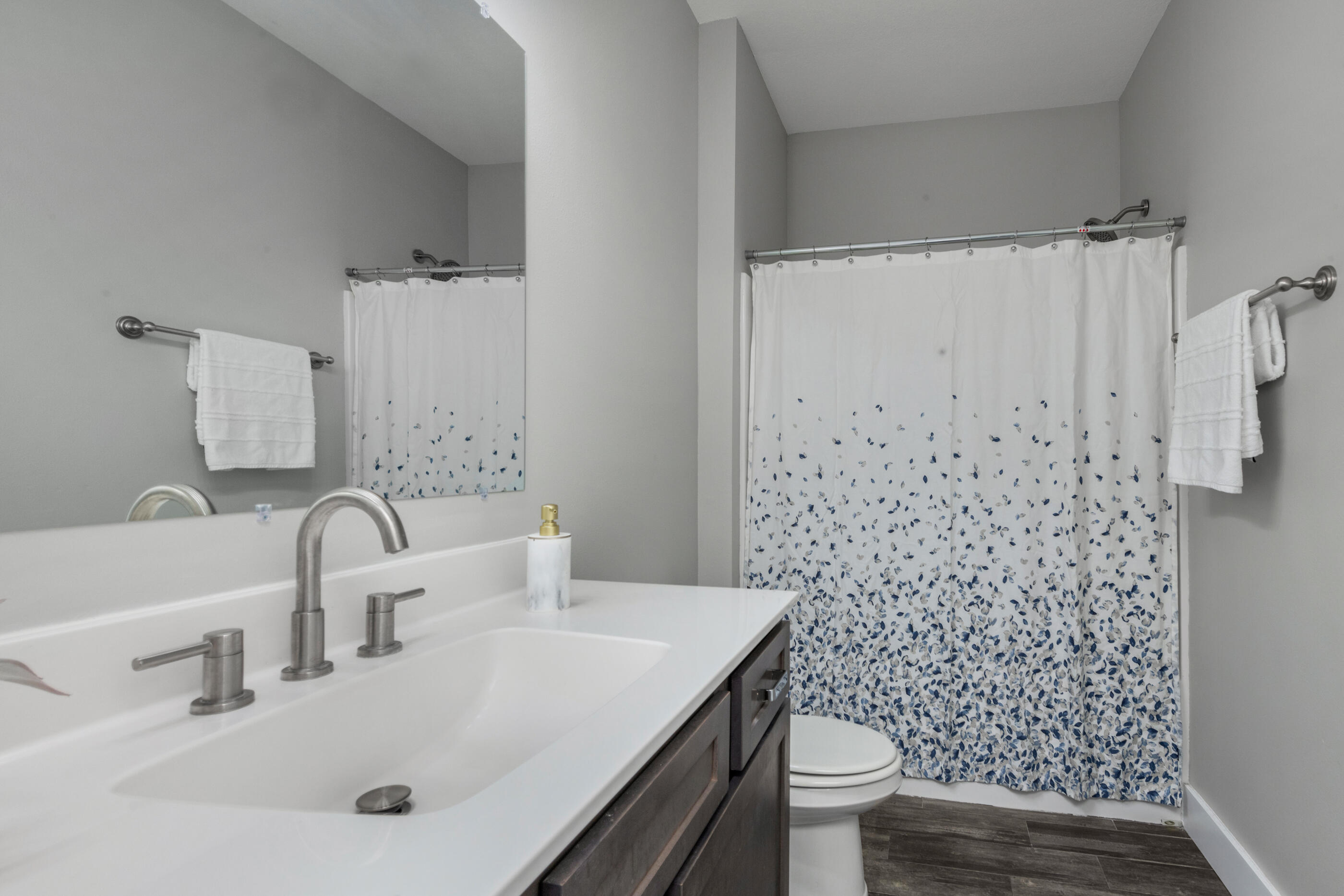 1504 West Ponderosa Road Fort Walton Beach, FL 32547 - Photo 39 of 51 a bathroom with a sink toilet and shower