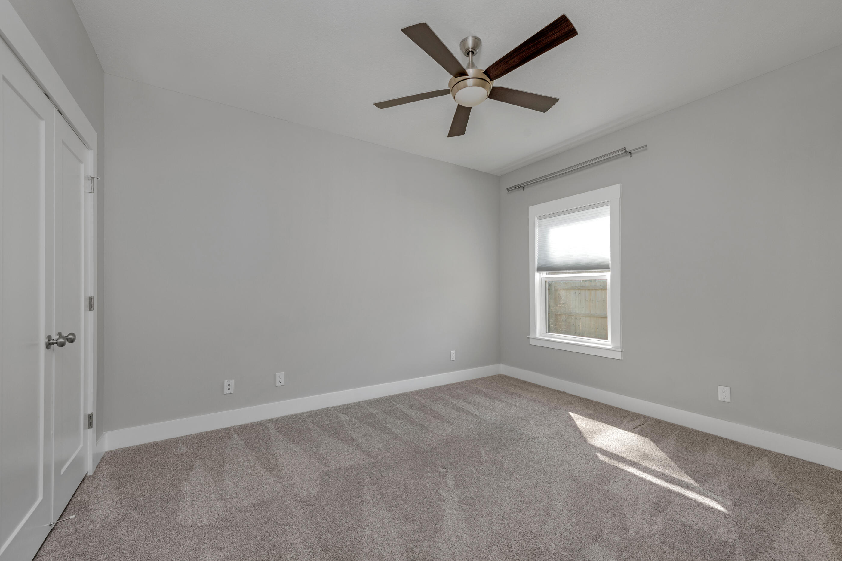 1504 West Ponderosa Road Fort Walton Beach, FL 32547 - Photo 40 of 51 an empty room with a window and a fan