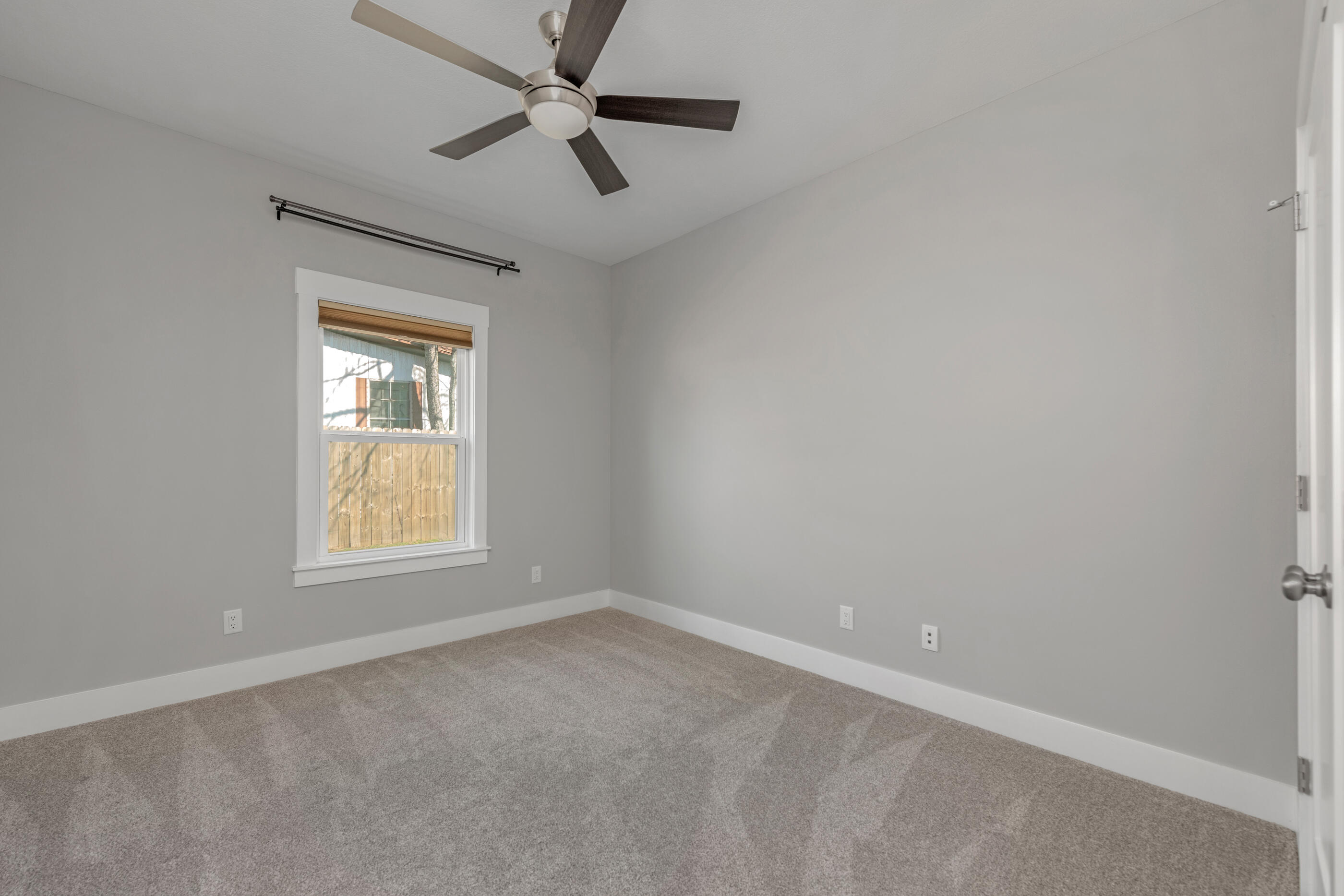1504 West Ponderosa Road Fort Walton Beach, FL 32547 - Photo 42 of 51 an empty room with a window and a fan