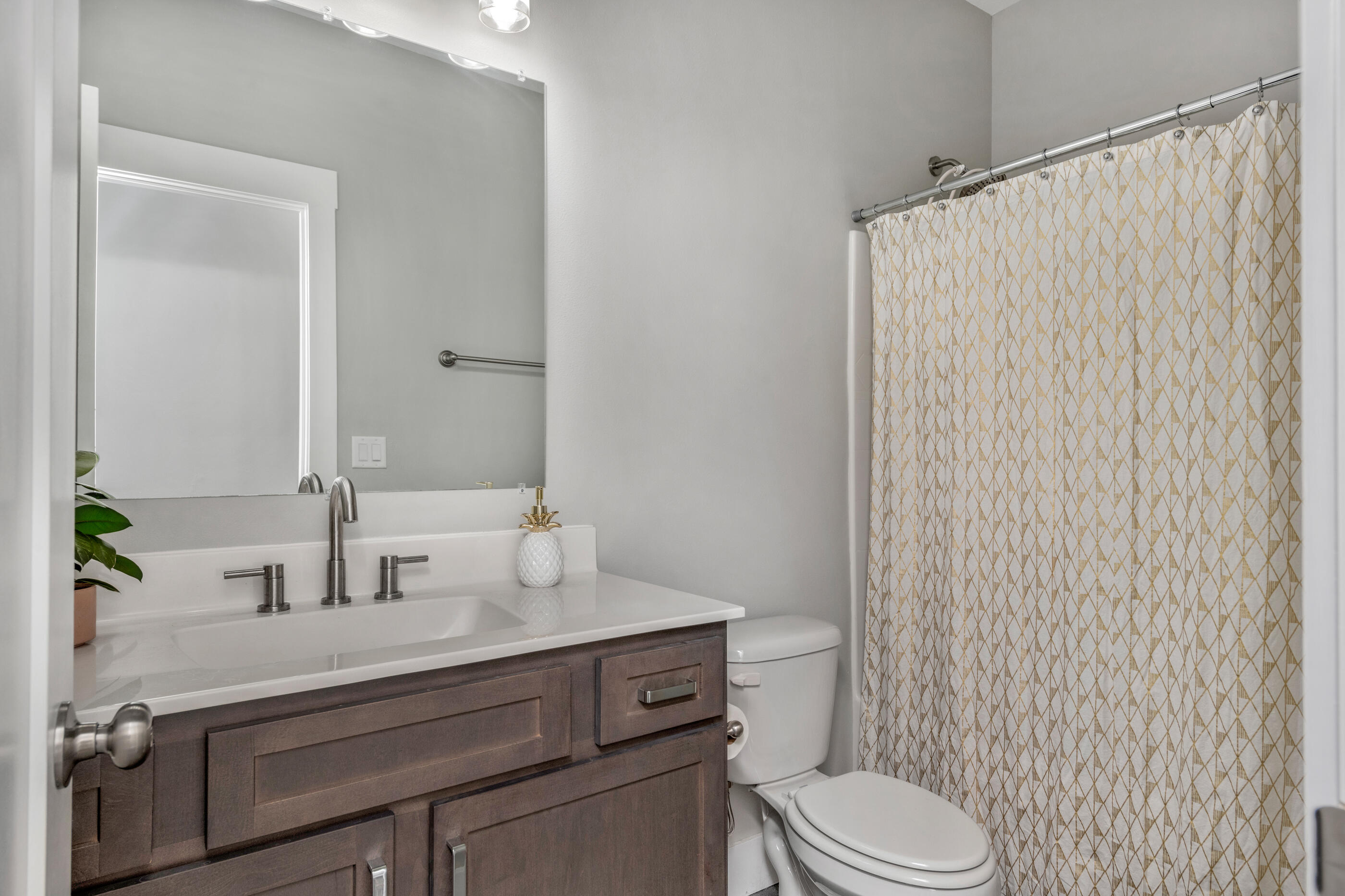 1504 West Ponderosa Road Fort Walton Beach, FL 32547 - Photo 44 of 51 a bathroom with a sink a toilet and shower