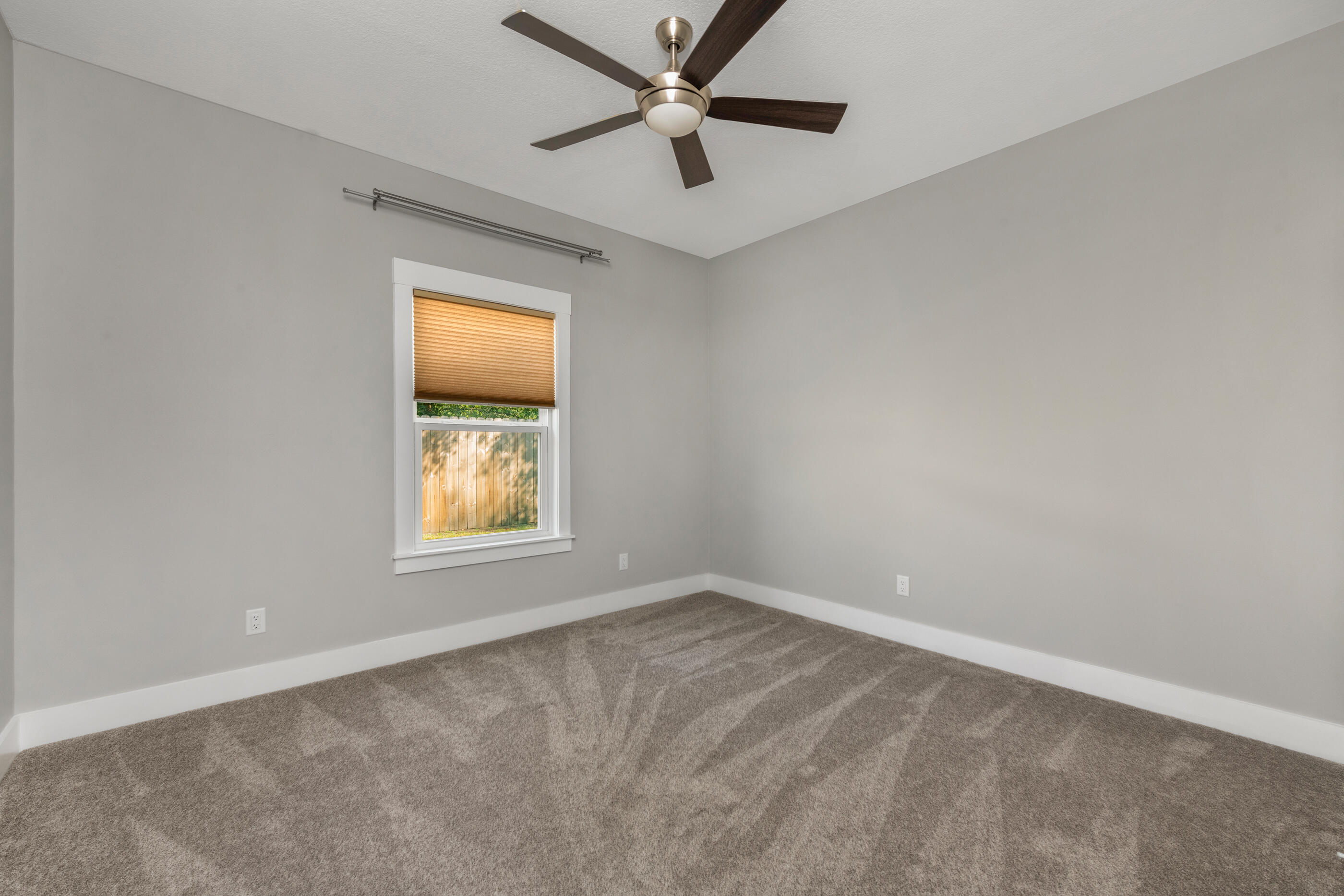 1504 West Ponderosa Road Fort Walton Beach, FL 32547 - Photo 45 of 51 an empty room with a window and a fan