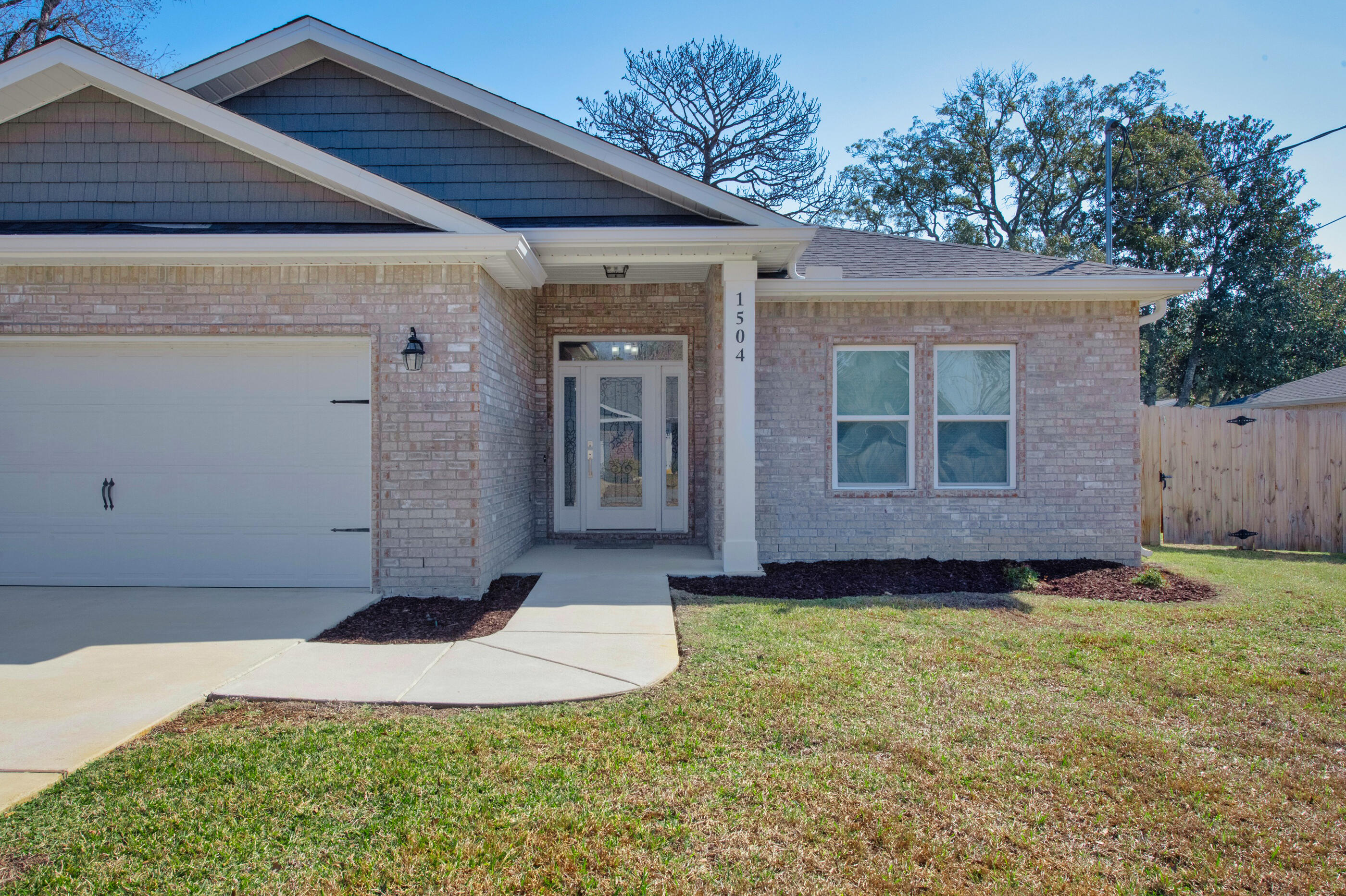 1504 West Ponderosa Road Fort Walton Beach, FL 32547 - Photo 50 of 51 a view of an house with backyard space and garden