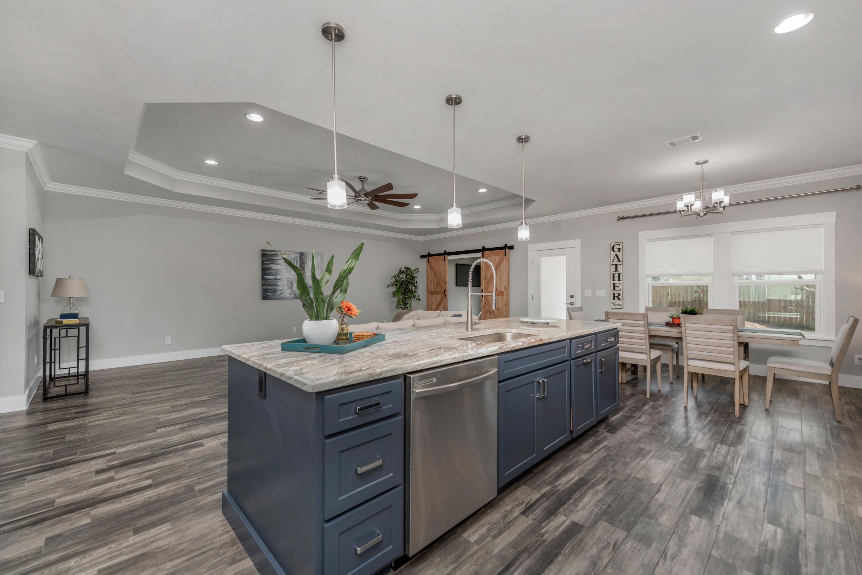 1504 West Ponderosa Road Fort Walton Beach, FL 32547 - Photo 6 of 51 a kitchen with stainless steel appliances granite countertop a sink counter space and wooden floor