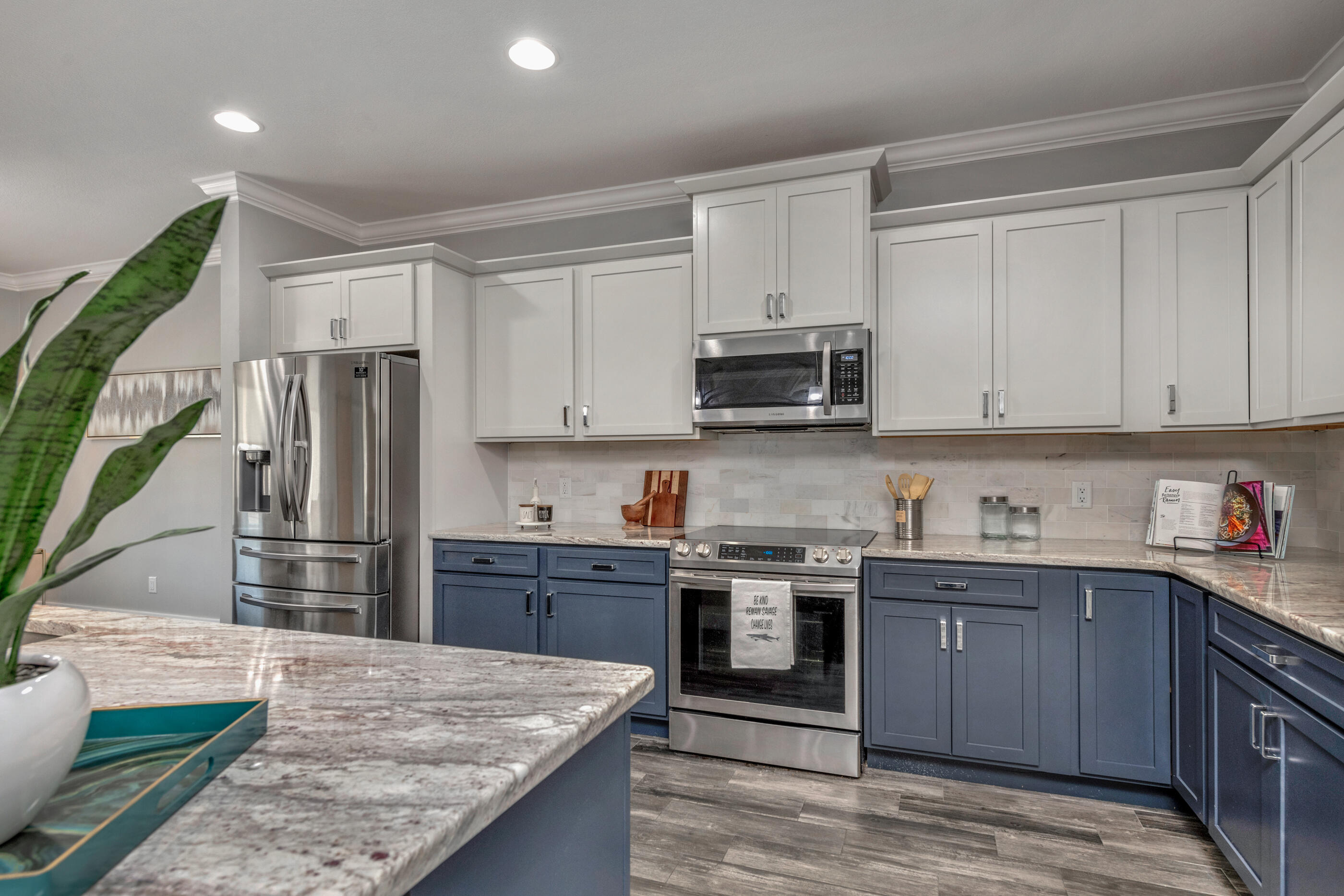 1504 West Ponderosa Road Fort Walton Beach, FL 32547 - Photo 7 of 51 a kitchen with kitchen island granite countertop a sink stove and refrigerator
