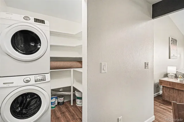 a view of a hallway with washer and dryer