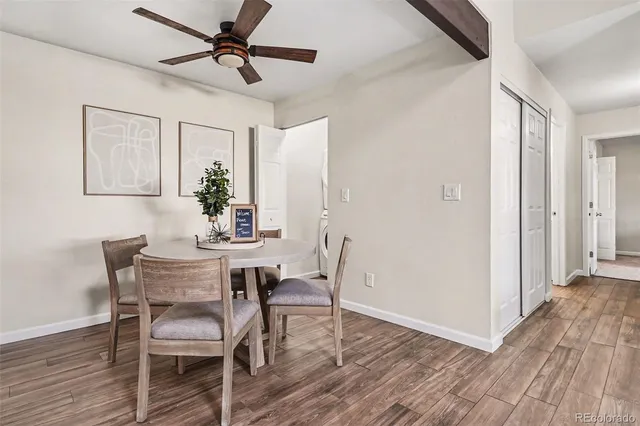 a view of a dining room with furniture and wooden floor