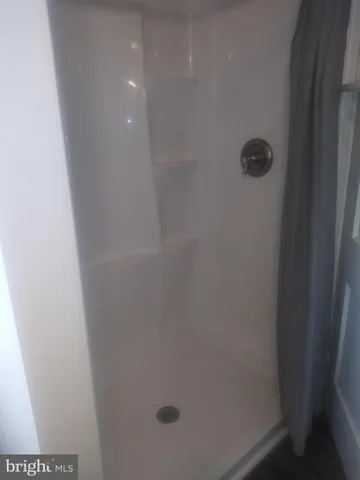 a view of entryway with kitchen