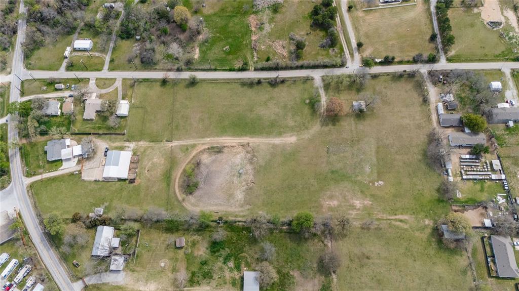 924 Fox Lane Azle, TX 76020 - Photo 4 of 8 Expansive green acreage featuring a visible pond and surrounding residential properties
