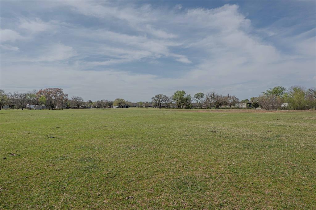 924 Fox Lane Azle, TX 76020 - Photo 5 of 8 Expansive green field with natural ground cover