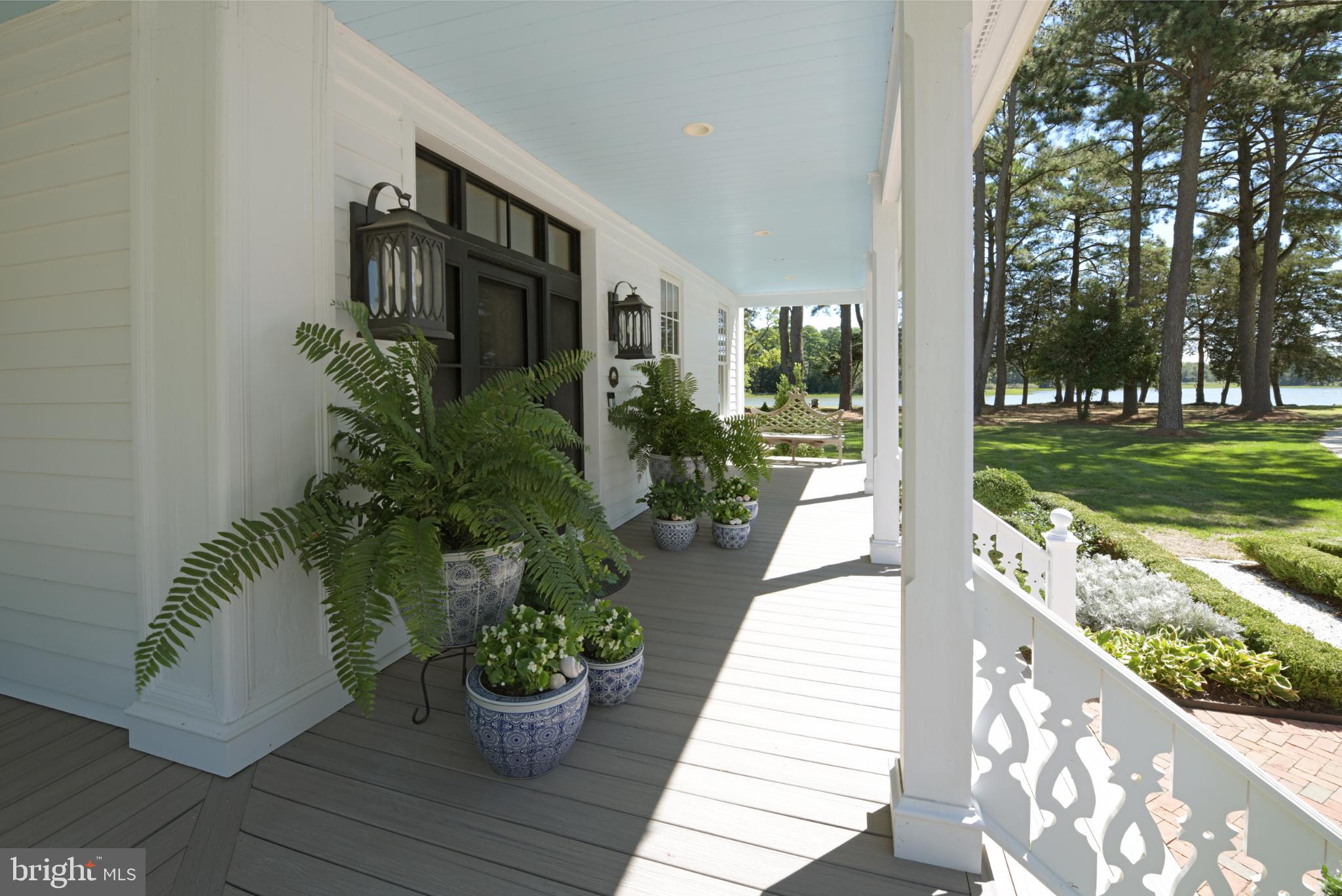 20031 Oakland Farm Road Cape Charles, VA 23310 - Photo 15 of 98 Front door and porch with lush greenery and views.