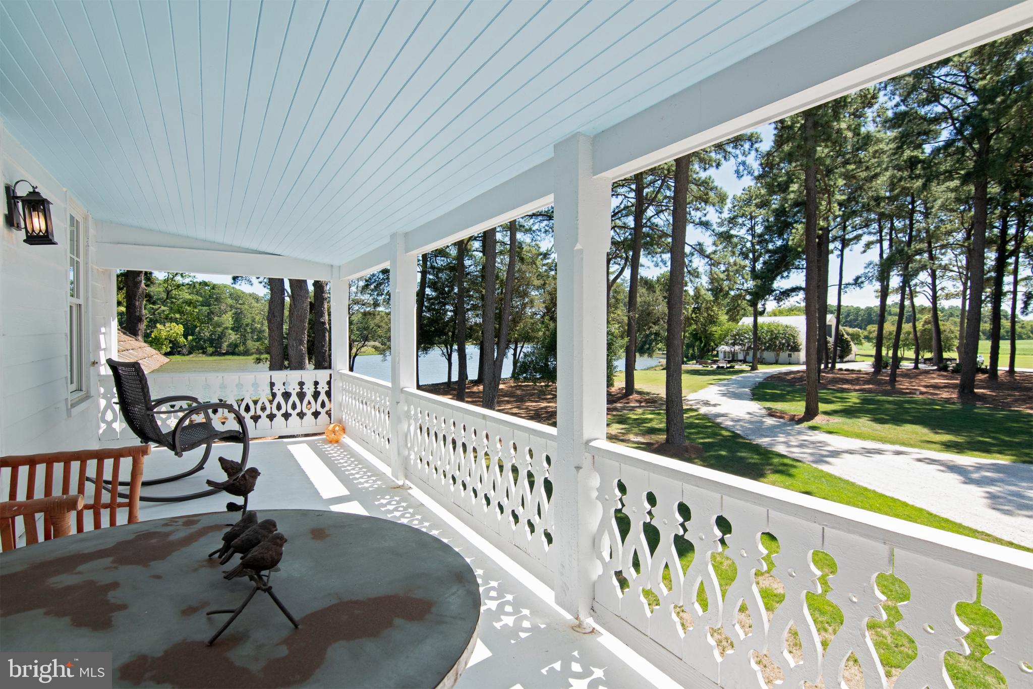 20031 Oakland Farm Road Cape Charles, VA 23310 - Photo 34 of 98 Serene lakeside porch with scenic views
