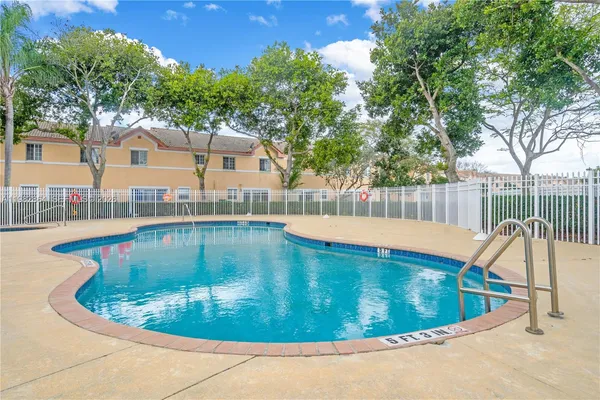 a view of a swimming pool with a patio
