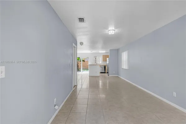a view of a hallway with wooden shelves