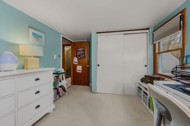 a view of room with window and furniture