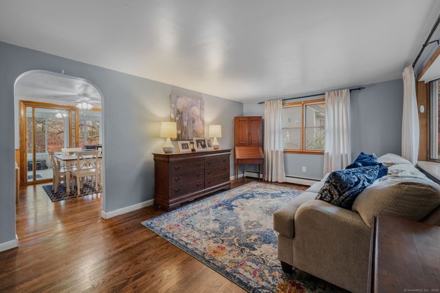 a bed room with a bed window and a mirror