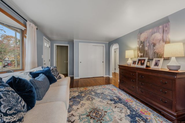 a bed room with a bed and a dresser