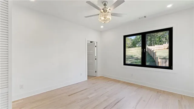 a bathroom with a shower sink vanity and toilet