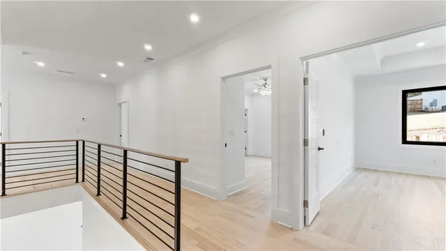 a view of a room with wooden floor