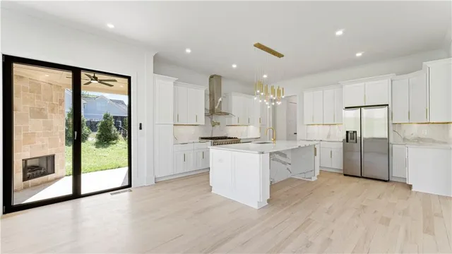 a view of an empty room with window and cabinet