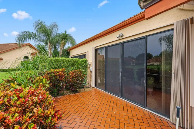 an aerial view of a pool patio and outdoor seating
