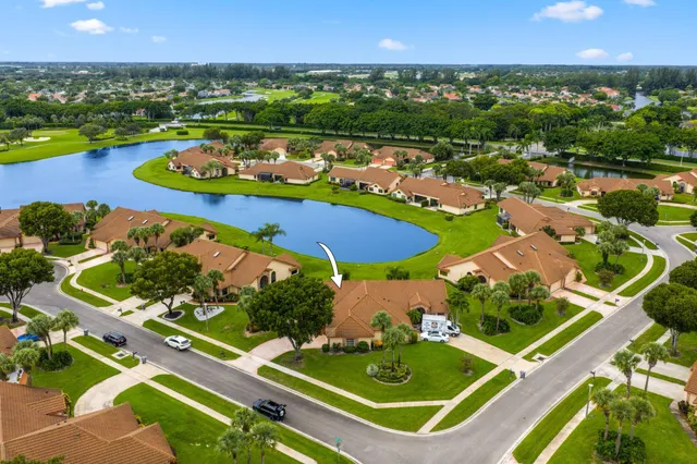 an aerial view of a house with a lake view