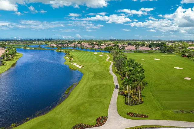 an aerial view of a house with a ocean view