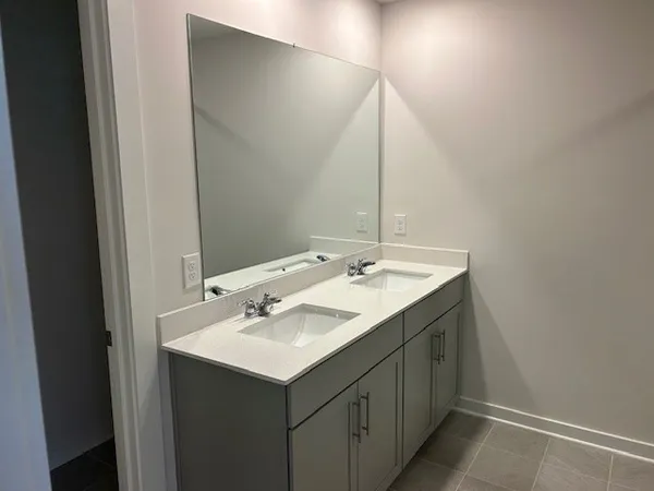 a bathroom with a sink and mirror