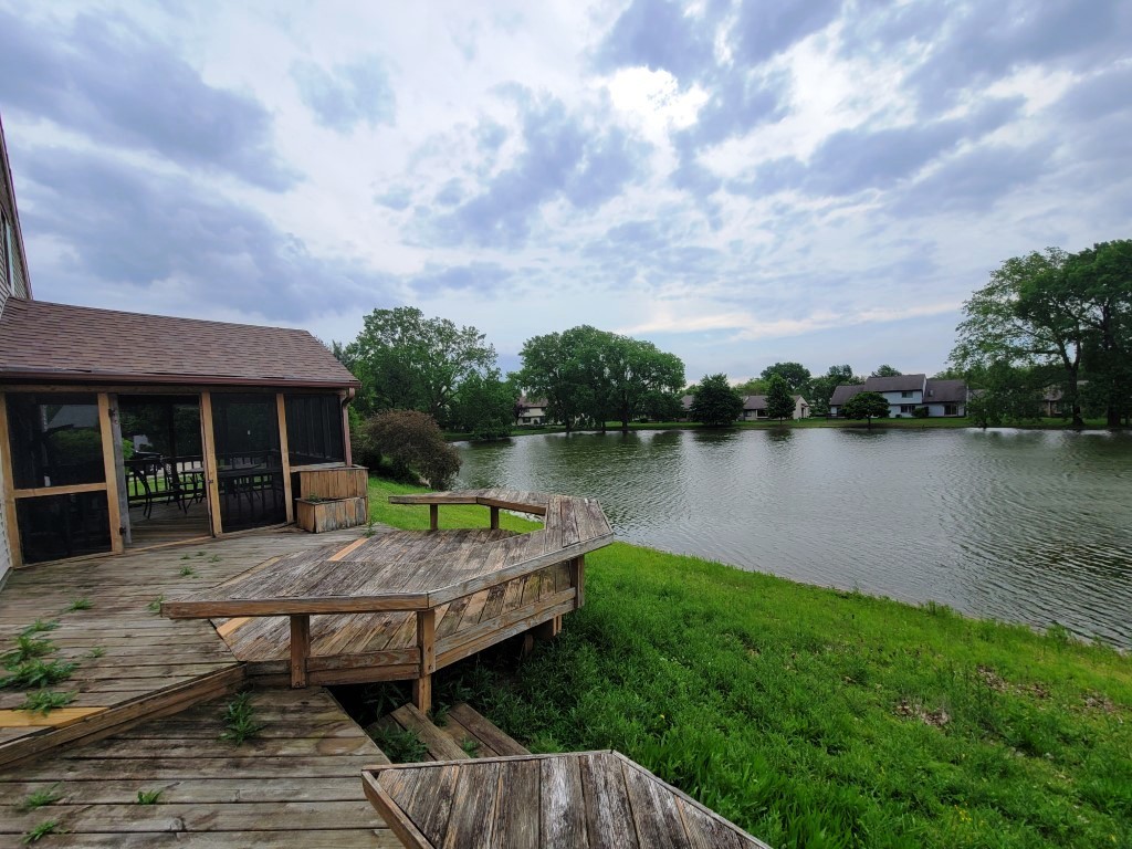 2601 Rachel Road Champaign, IL 61822 - Photo 22 of 22 a view of a backyard with plants and lake view