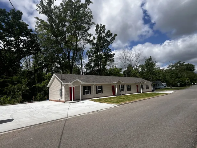 a house with river in front of it