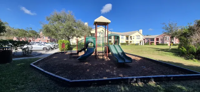 a living room with fireplace furniture and a large window