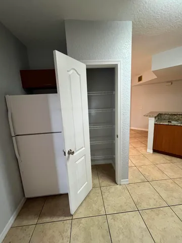 a utility room with cabinets