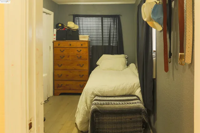 a bed room with a bed and a television